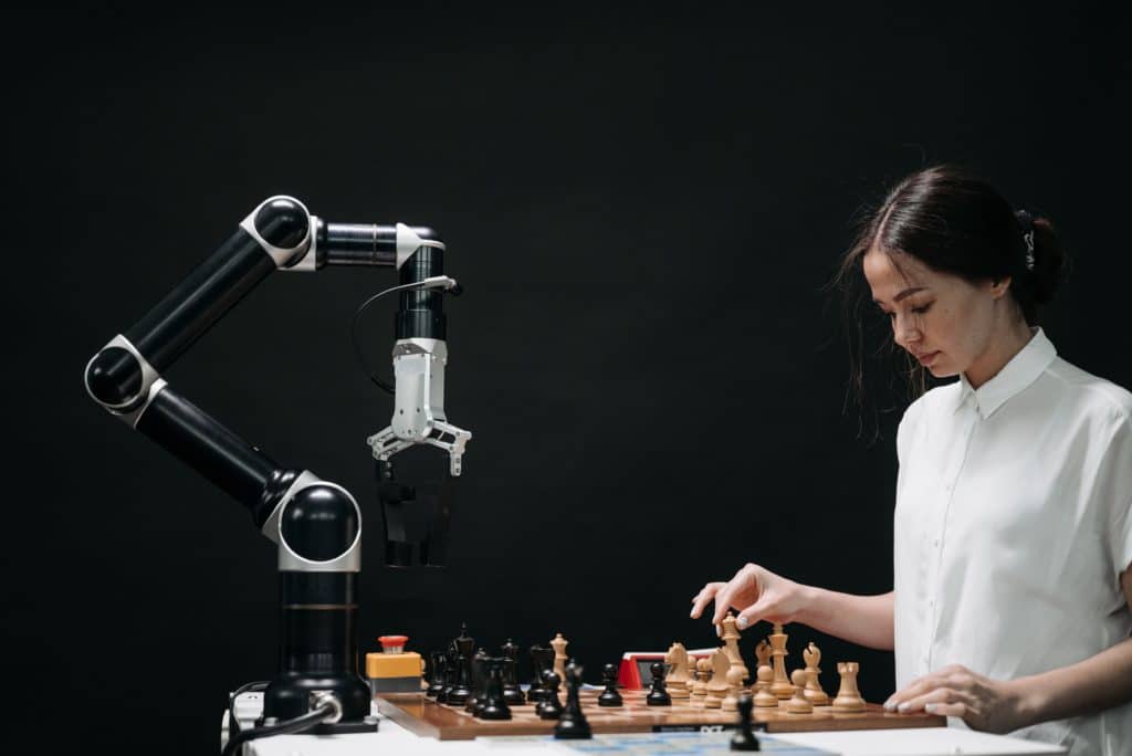 A human plays chess against an AI-powered robot