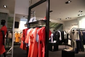 Racks of clothes inside a clothes shop